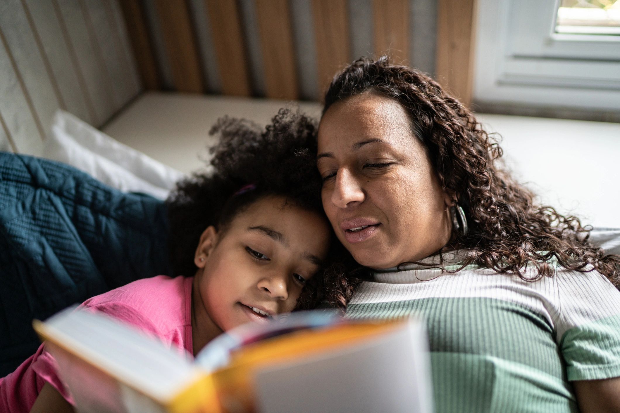 Parent reading with a child at home