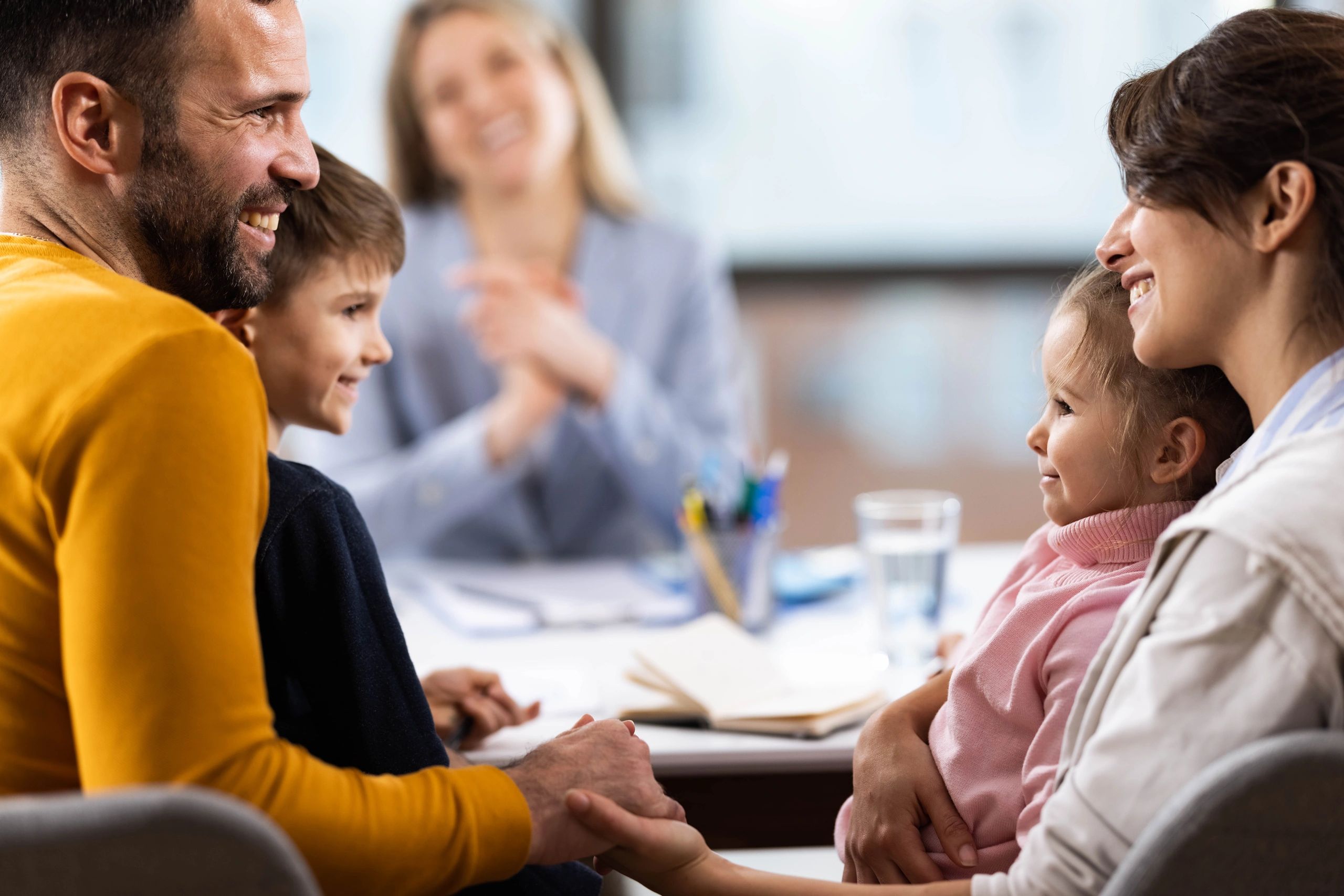 Family meeting with an educator in an office setting