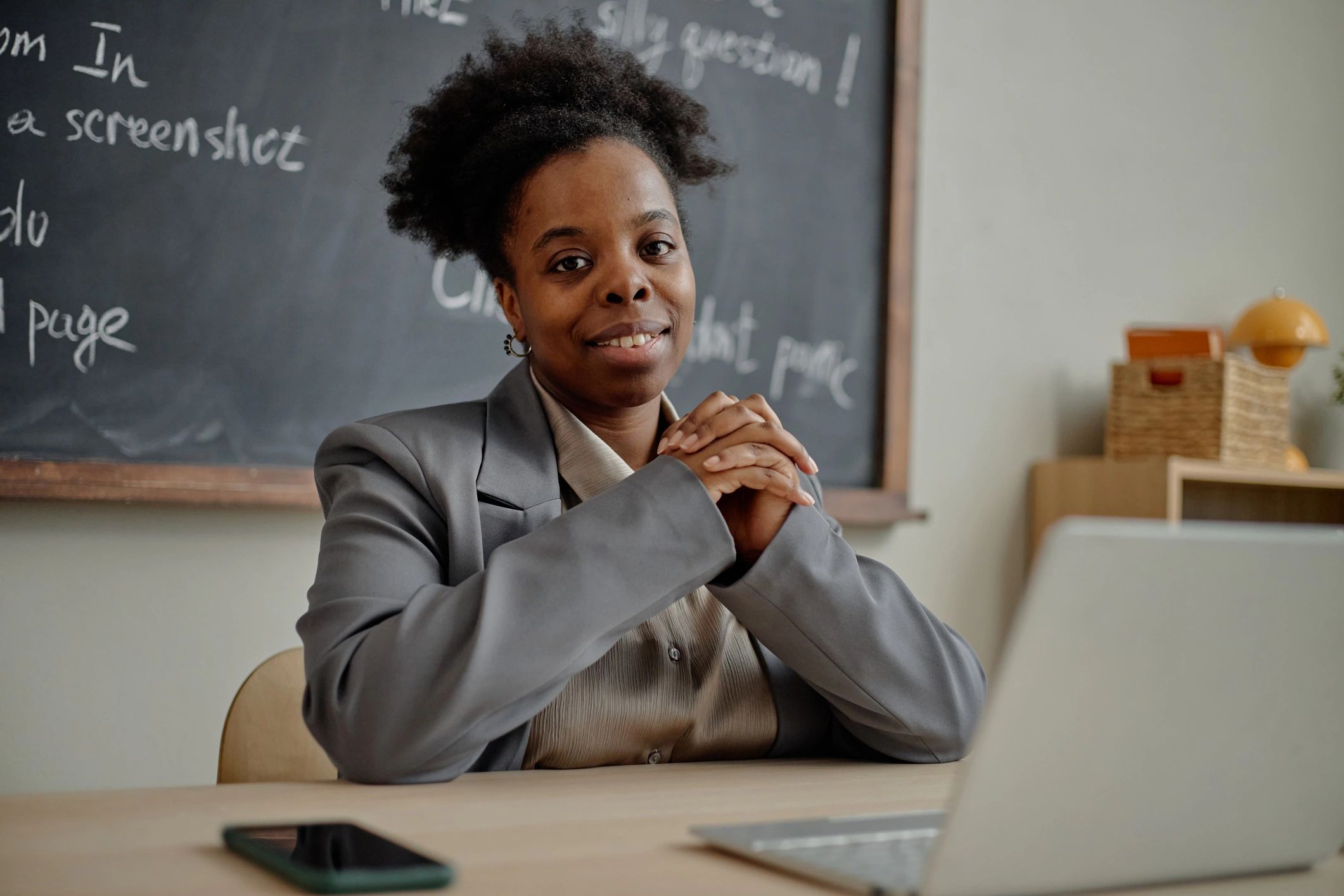Smiling educator in a classroom
